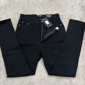 Brand new with tags black skinny jeans. Size 15.